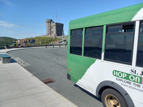 Hop On Hopp Off bus with Cabot Tower in the background