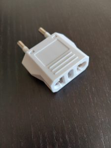 Adapter to convert Cdn plug style to Portuguese plug.