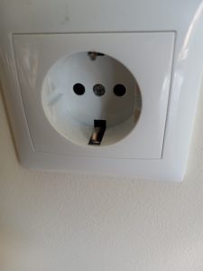 Portuguese wall socket into which devices are plugged.