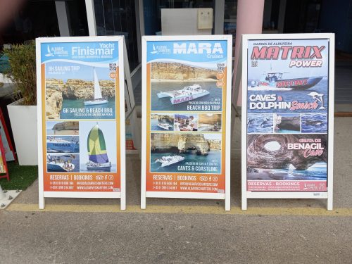 Tour boat outfitters offering their wares at Albufeira Marina