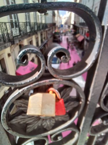 "Love Locks" on the walkway over the pink road on downtown Lisbon in 2025.