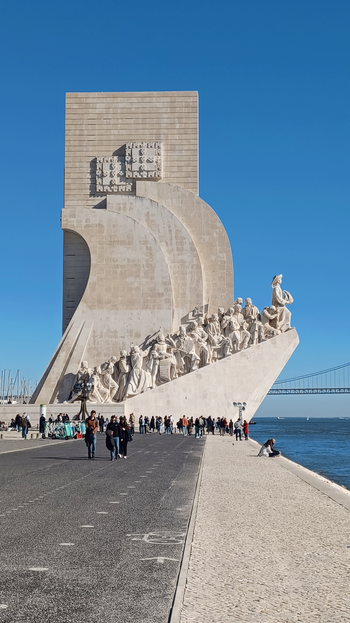 Figures climbing the Monument to Discovery ion the Lisbon waterfront